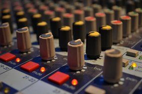 audio mixing board in music studio