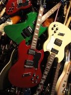 A lot of electric guitar in a pile