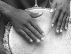 hands on drum in black and white background