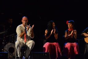 clapping flamenco musicians on scene