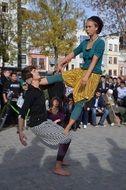 The girl and the guy dancing on the street