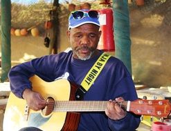 old musician with guitar