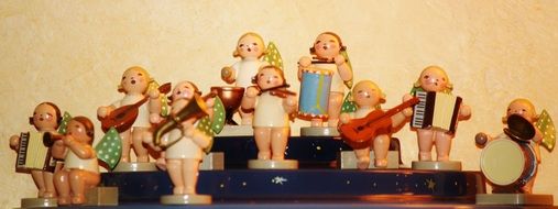 figures of christmas angels with musical instruments