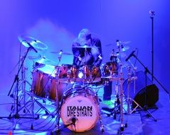 drummer plays the drum set in Italy