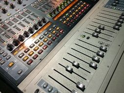 gray audio mixer in a sound studio