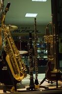 saxophone in the window of a music store