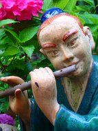 Sculpture of an Asian flutist