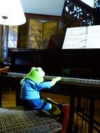 kermit frog playing piano