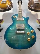 Blue guitar on the stand with guitars