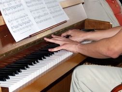 hands on piano keys