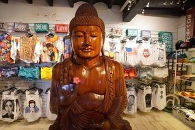 statue of a wooden buddha in the shop