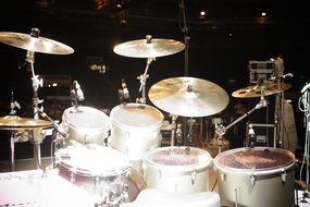 drum kit and cymbals on stage