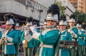 group of mercy in costumes and musical instruments