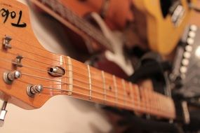 closeup picture of strung silver guitar strings