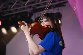 violinist on a bright stage