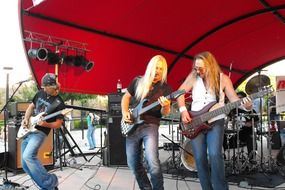 guitarists at a street concert of live music