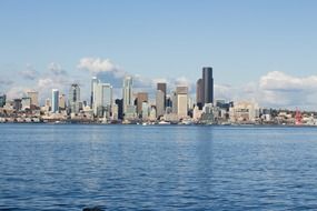 skyline of modern city at sunny day from water, usa, washington, seattle