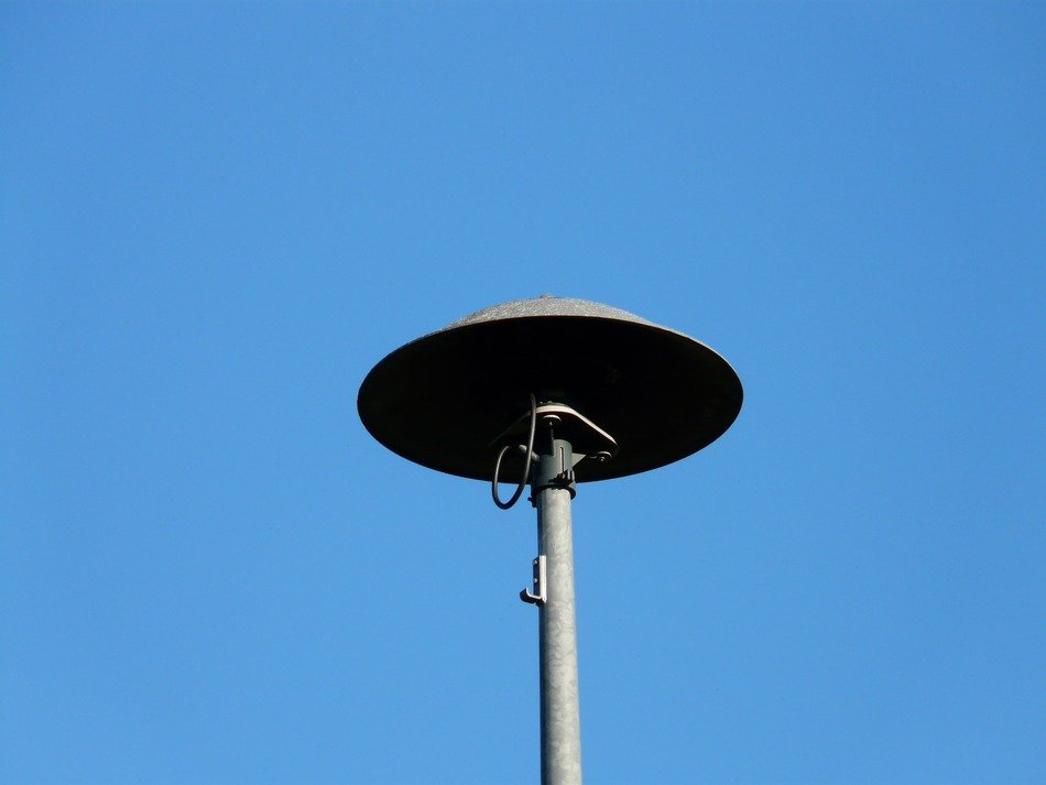 mechanical fire siren against the sky