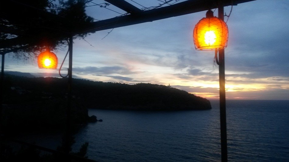 street orange lights on the background of the sea