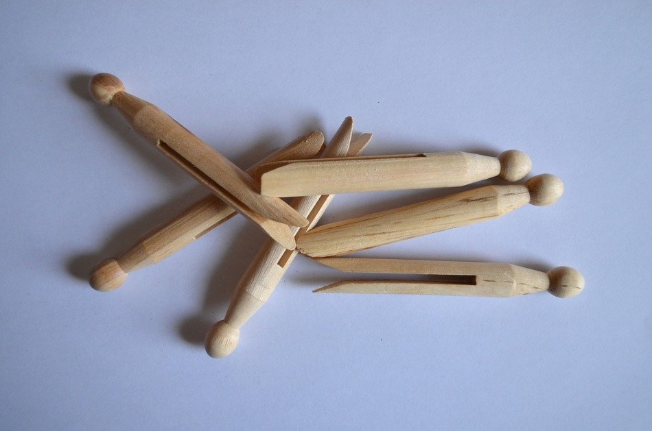 clothespins for washing on a purple background