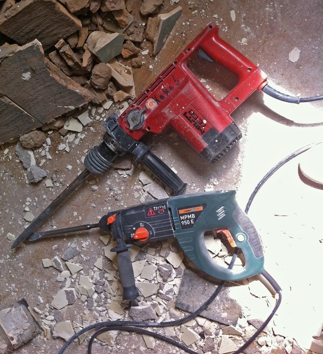 Two hammer drills on the ground