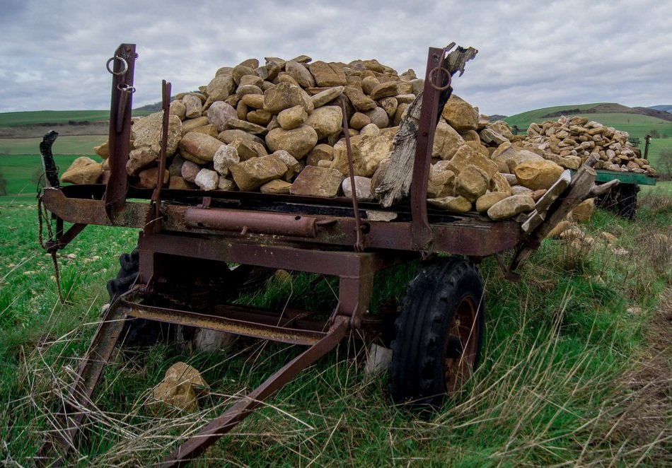 cart with stones in the field
