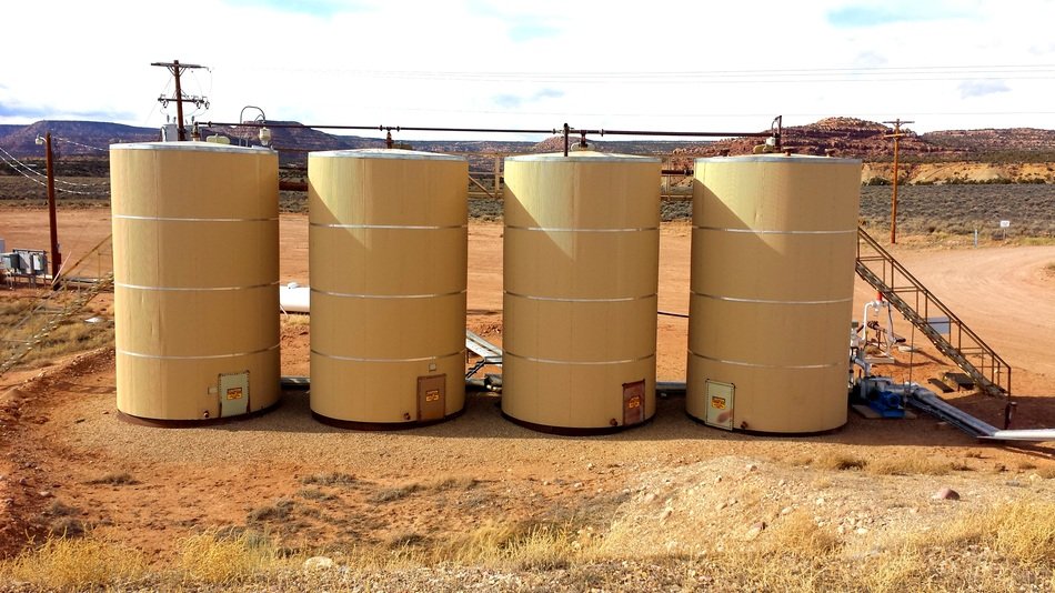 four oil refinery silos in desert