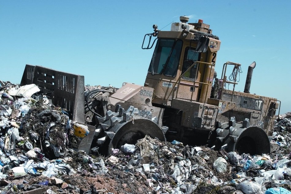 Compactor on trash