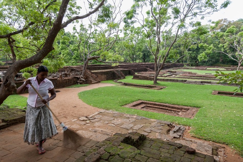 woman cleans in the park