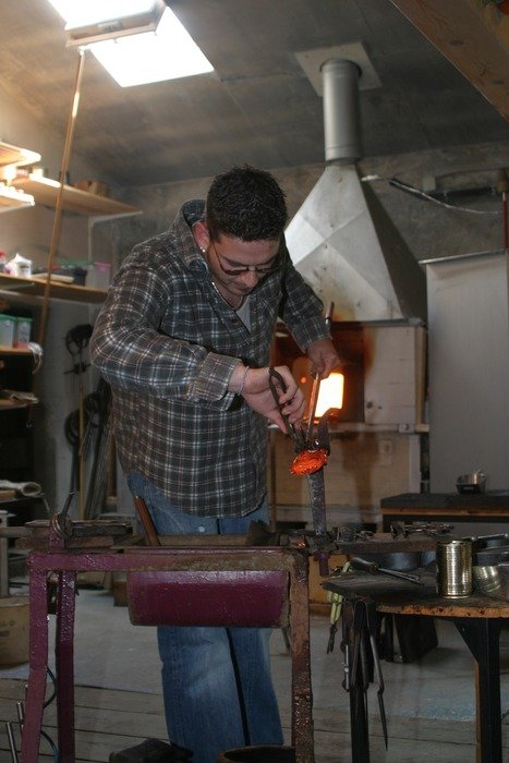 young glassblower at work