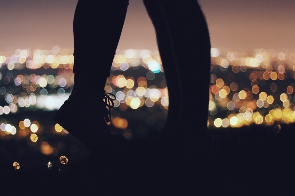 a girl and a guy are standing in a romantic pose