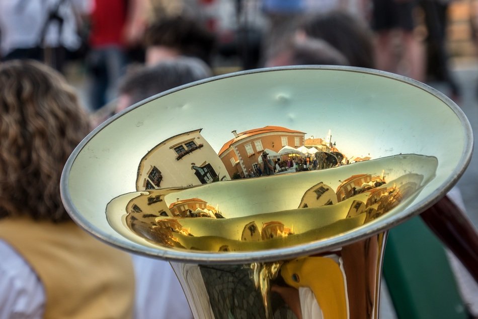 reflection of the street in a musical instrument