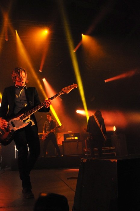 Guitarist on stage in the light of soffits
