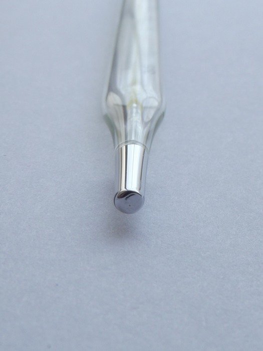 Thermometer on a gray background