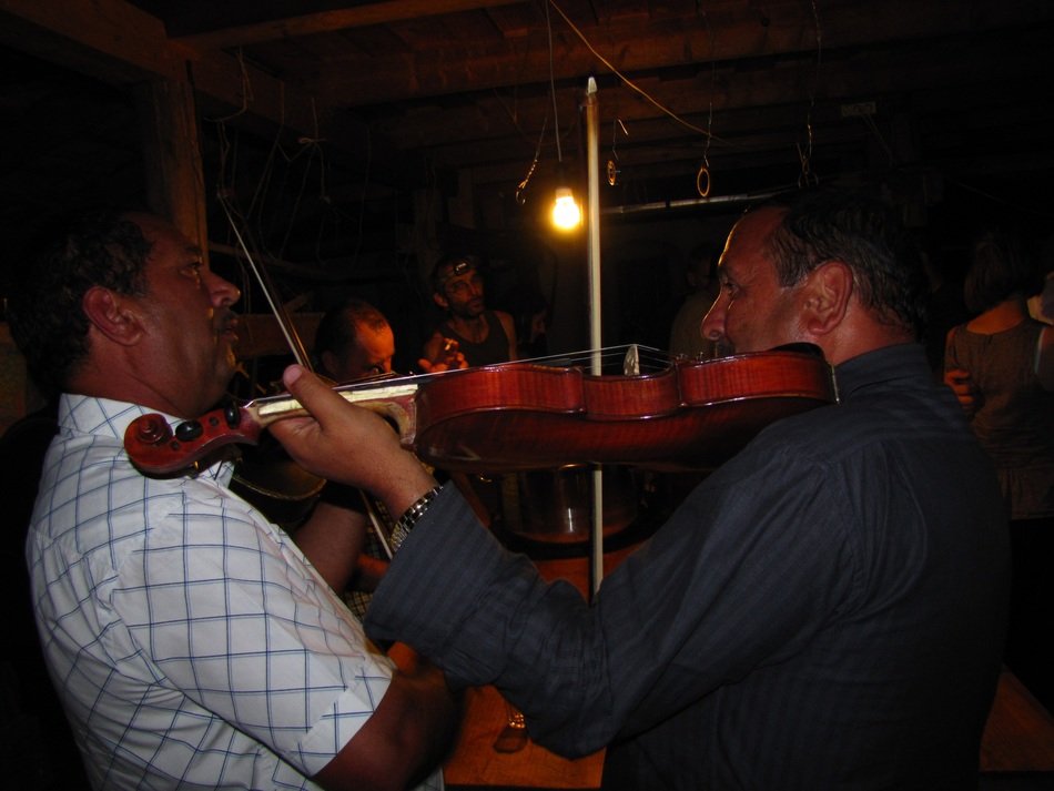 Violin in the hands of men on perfomance