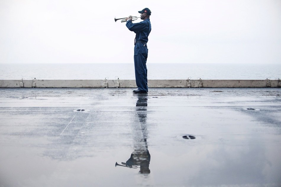 trumpeter on the pier