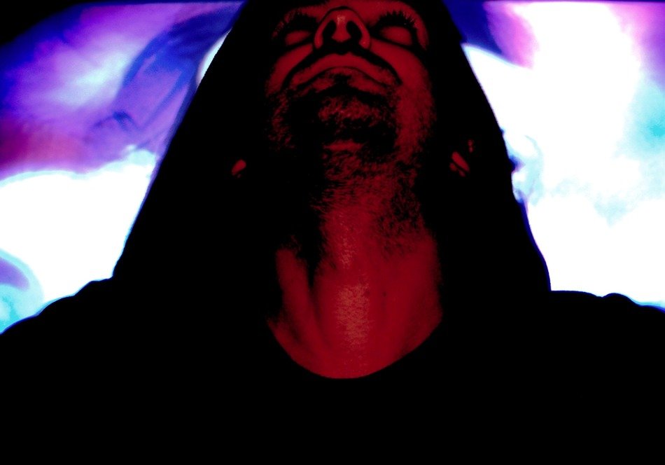 man looking up, lights at background