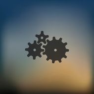 cogwheel icon on blurred background