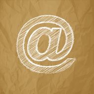 Scribble email symbol on a crumpled paper brown background