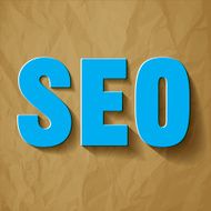 SEO symbol blue on a crumpled paper brown background