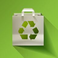 Paper bag recycling symbol on a green background