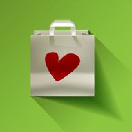 Paper bag with herat red on a green background