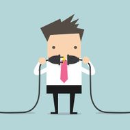 Businessman connecting a power cord