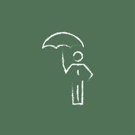 Businessman with umbrella icon drawn in chalk