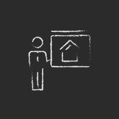 Real estate agent showing the house icon drawn in chalk N2