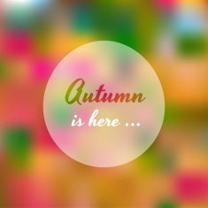 Blurred autumn colorful tree with Autumn is here text