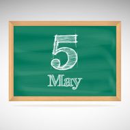 May 5 inscription in chalk on a blackboard