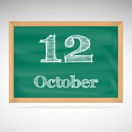 October 12 inscription in chalk on a blackboard
