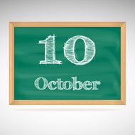 October 10 inscription in chalk on a blackboard