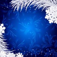 Blue Christmas holiday background with snowflakes and silver fir twig